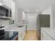Modern kitchen featuring stainless steel appliances, granite countertops, and white cabinetry at 818 Ballard St, Altamonte Springs, FL 32701
