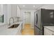 Modern kitchen featuring stainless steel appliances and light-colored cabinetry at 818 Ballard St, Altamonte Springs, FL 32701