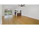 Spacious open-concept design featuring hardwood floors and a combined living room and kitchen at 818 Ballard St, Altamonte Springs, FL 32701