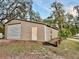Large outbuilding with roll-up door providing ample storage for equipment and hobbies at 822 S Breen Rd, Lake Wales, FL 33898