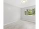 Bedroom featuring tile floors, neutral paint and a window with a view to a landscaped yard at 8310 Happy Trails, Kissimmee, FL 34747