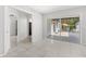 Bright bedroom featuring a closet and a large sliding glass door that leads to an outdoor patio and furniture at 8310 Happy Trails, Kissimmee, FL 34747