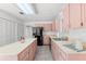 Well-lit kitchen with a black fridge, lots of counter space, and tile flooring at 8310 Happy Trails, Kissimmee, FL 34747