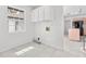 Laundry room with tile floors, storage cabinets, and washer and dryer hookups at 8310 Happy Trails, Kissimmee, FL 34747