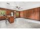 Living room with wood paneling and a bar at 8310 Happy Trails, Kissimmee, FL 34747