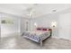 Open main bedroom featuring tile floors, ceiling fan, neutral paint and ensuite bathroom at 8310 Happy Trails, Kissimmee, FL 34747