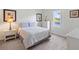 Bright bedroom featuring a double bed, carpeted floors, and a large window at 833 Brunello Dr, Davenport, FL 33897