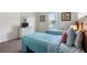 Bedroom featuring two twin beds, a window, and dresser at 833 Brunello Dr, Davenport, FL 33897