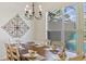 Elegant dining area with chandelier lighting and a view of the pool creating a perfect setting for meals at 833 Brunello Dr, Davenport, FL 33897