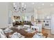 Open-concept dining area flowing into the living room and kitchen providing an ideal space for entertaining guests at 833 Brunello Dr, Davenport, FL 33897