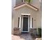 Inviting entryway with stone accents and a covered porch, leading to the front door at 833 Brunello Dr, Davenport, FL 33897