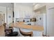 Bright kitchen featuring white appliances, cabinets, counter seating and ample storage space at 833 Brunello Dr, Davenport, FL 33897