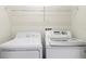 Bright laundry room with a white washer and dryer at 833 Brunello Dr, Davenport, FL 33897