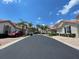 Charming neighborhood street view showcasing well-maintained homes and lush landscaping at 833 Brunello Dr, Davenport, FL 33897