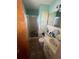 A full bathroom features a glass shower and vanity with tile backsplash at 848 Wildabon Ave, Lake Wales, FL 33853