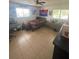 Bedroom with tile flooring, ceiling fan, and windows at 848 Wildabon Ave, Lake Wales, FL 33853