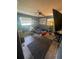 Bedroom with a ceiling fan, carpet and large windows at 848 Wildabon Ave, Lake Wales, FL 33853