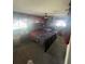 Bedroom featuring a king size bed, a ceiling fan and dark walls at 848 Wildabon Ave, Lake Wales, FL 33853