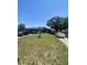 View of a single story house with driveway, front lawn, and two cars at 848 Wildabon Ave, Lake Wales, FL 33853