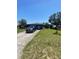 Charming single-story home with a well-kept lawn, driveway, and dark exterior paint at 848 Wildabon Ave, Lake Wales, FL 33853