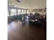 Spacious living room with hardwood floors, large windows and two sofas at 848 Wildabon Ave, Lake Wales, FL 33853