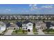 Aerial view of a residential neighborhood with well-maintained homes and landscaping at 895 Overpool Ave, Davenport, FL 33896