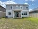 Spacious backyard featuring a patio, seating, and a well-maintained lawn at 895 Overpool Ave, Davenport, FL 33896