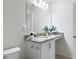Clean bathroom with a large mirror and granite vanity top at 895 Overpool Ave, Davenport, FL 33896