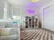 Charming Bedroom with crib, bookcase and decor at 895 Overpool Ave, Davenport, FL 33896