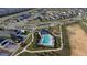 Birds eye view of the pool and surrounding area that has a play area in the neighborhood at 895 Overpool Ave, Davenport, FL 33896