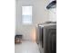 Clean laundry room featuring modern washer and dryer at 895 Overpool Ave, Davenport, FL 33896