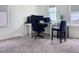 Spacious office with a large desk, ergonomic chair, and ample natural light for a comfortable workspace at 895 Overpool Ave, Davenport, FL 33896