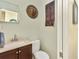 Bathroom featuring a sink, toilet, and vanity at 955 Mansfield Rd, Tavares, FL 32778