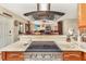 Modern kitchen features stainless steel appliances, granite countertops and custom cabinets at 955 Mansfield Rd, Tavares, FL 32778