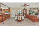 Open-concept living area with dining table and chairs, bar seating and view of the water at 955 Mansfield Rd, Tavares, FL 32778