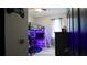 A gamer's bedroom including a lofted bed and gaming area, all accentuated with vibrant LED lighting at 1025 Belvoir Dr, Kissimmee, FL 34744