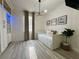 Bright bedroom with a daybed, hardwood floors, ample storage, and natural light at 1025 Belvoir Dr, Kissimmee, FL 34744