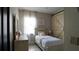 Cozy bedroom with a twin bed, rustic barn door, and a charming decor at 1025 Belvoir Dr, Kissimmee, FL 34744