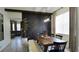 Stylish dining room featuring a wooden table, modern lighting, and chic decor, ideal for entertaining guests and Gathering at 1025 Belvoir Dr, Kissimmee, FL 34744