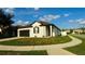 Beautifully landscaped corner lot featuring a charming single-story home, complemented by a neatly kept lawn and inviting sidewalk at 1025 Belvoir Dr, Kissimmee, FL 34744