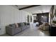Elegant living room featuring a modern sofa, stylish decor, and wood-look flooring, creating a welcoming atmosphere at 1025 Belvoir Dr, Kissimmee, FL 34744