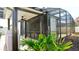 A large screened patio with a ceiling fan is accessible from the lawn area at 1025 Belvoir Dr, Kissimmee, FL 34744