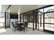 Inviting covered patio with seating, an outdoor TV, and views of the surrounding neighborhood at 1025 Belvoir Dr, Kissimmee, FL 34744