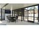 Enclosed patio featuring comfortable seating, outdoor television, and durable screen windows at 1025 Belvoir Dr, Kissimmee, FL 34744