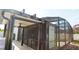 Exterior view of a screened-in patio with ceiling fan, and outdoor space at 1025 Belvoir Dr, Kissimmee, FL 34744