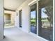 Spacious balcony featuring sliding glass doors and views of the community's greenery at 11037 Bagley Aly, Windermere, FL 34786