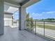 Balcony features light gray pavers and decorative pergola overlooking community lake at 11037 Bagley Aly, Windermere, FL 34786