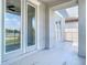 Residential balcony features light gray pavers and decorative pergola overlooking community lake at 11037 Bagley Aly, Windermere, FL 34786