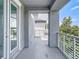 Balcony features light gray pavers and decorative pergola overlooking community at 11037 Bagley Aly, Windermere, FL 34786