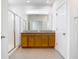 Modern bathroom with dual sinks, granite countertops, and glass shower at 11037 Bagley Aly, Windermere, FL 34786